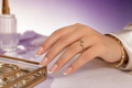 Gold Line French Press-on Nails worn by a Middle Eastern female hand model