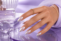 Blush Cat Eye Press-on Nails worn by a Middle Eastern hand model